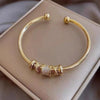 Bracciale Regolabile con Charms Dorati